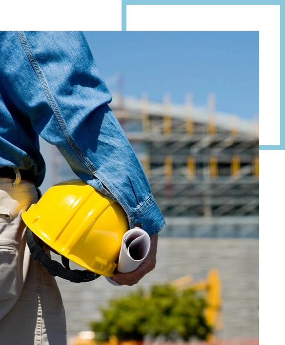 A construction worker holding onto a yellow helmet.