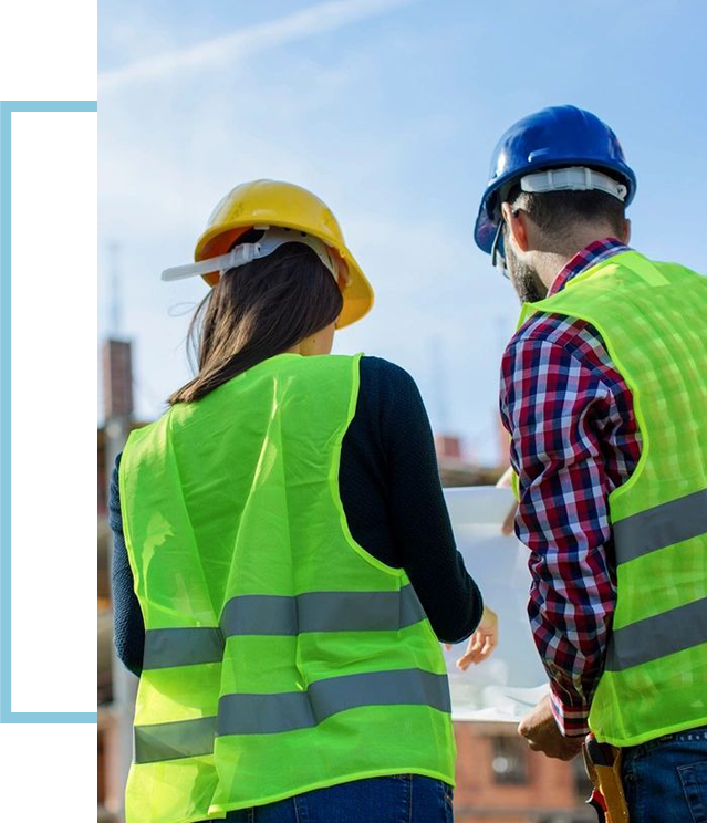 A group of people wearing safety vests and hard hats.