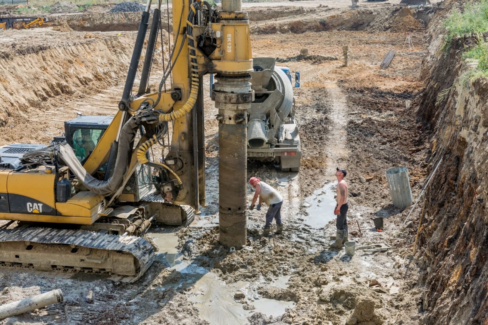 A large construction site with workers and machinery.