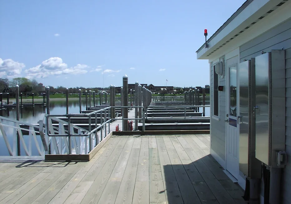 A dock with several boats docked on it.