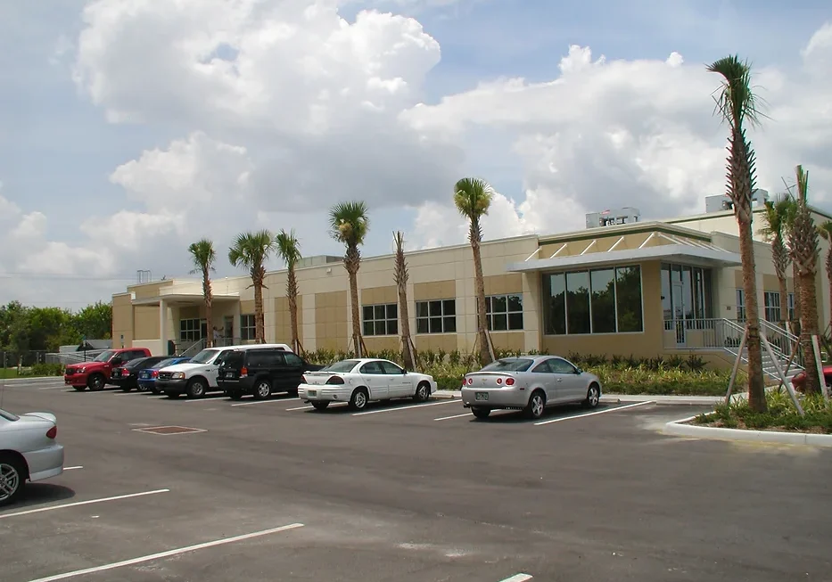 A parking lot with several cars parked in it.